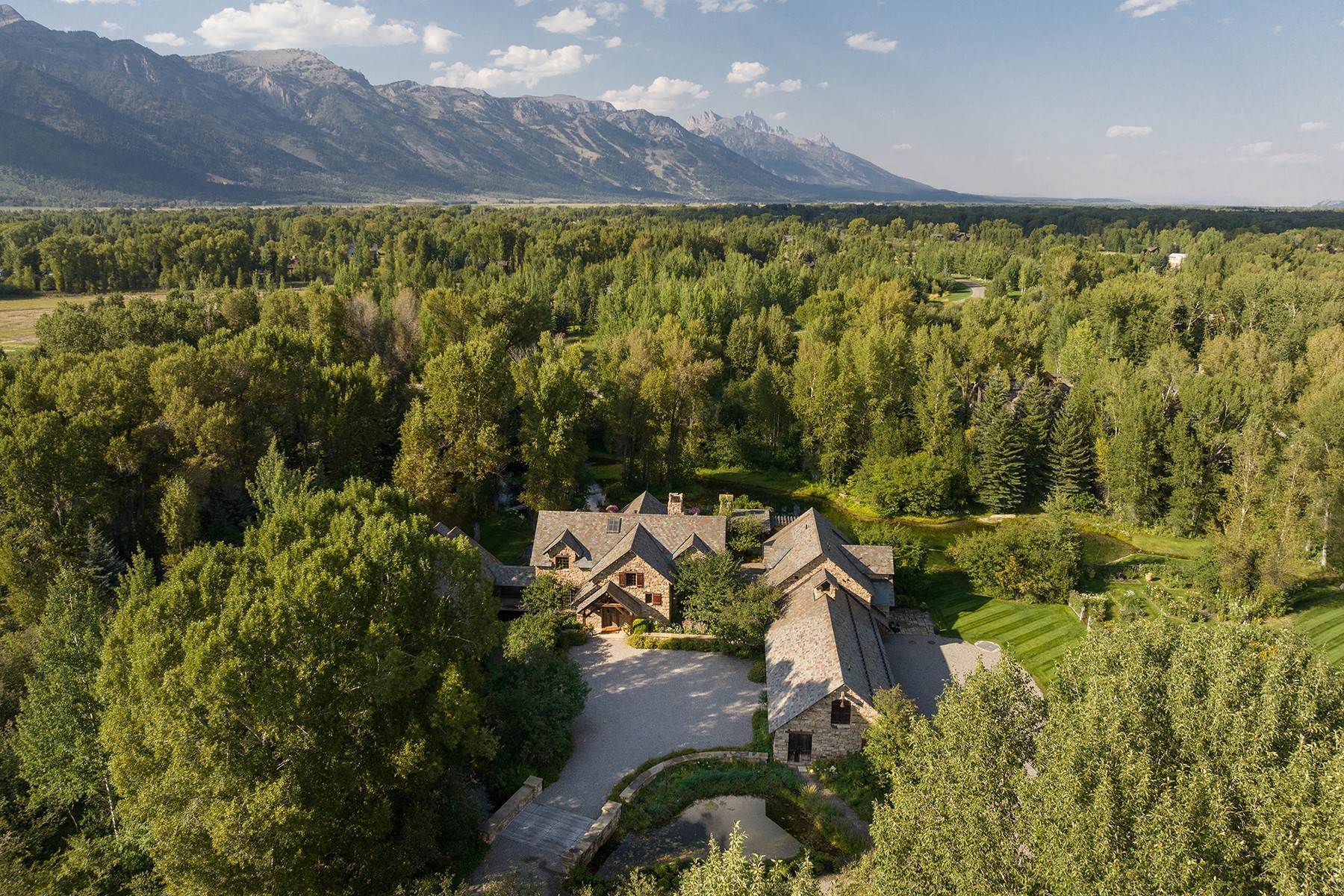 3. Single Family Homes for Sale at Enchanting Estate and Gardens in Tucker Ranch 3455 Tucker Ranch Road Wilson, Wyoming 83014 United States